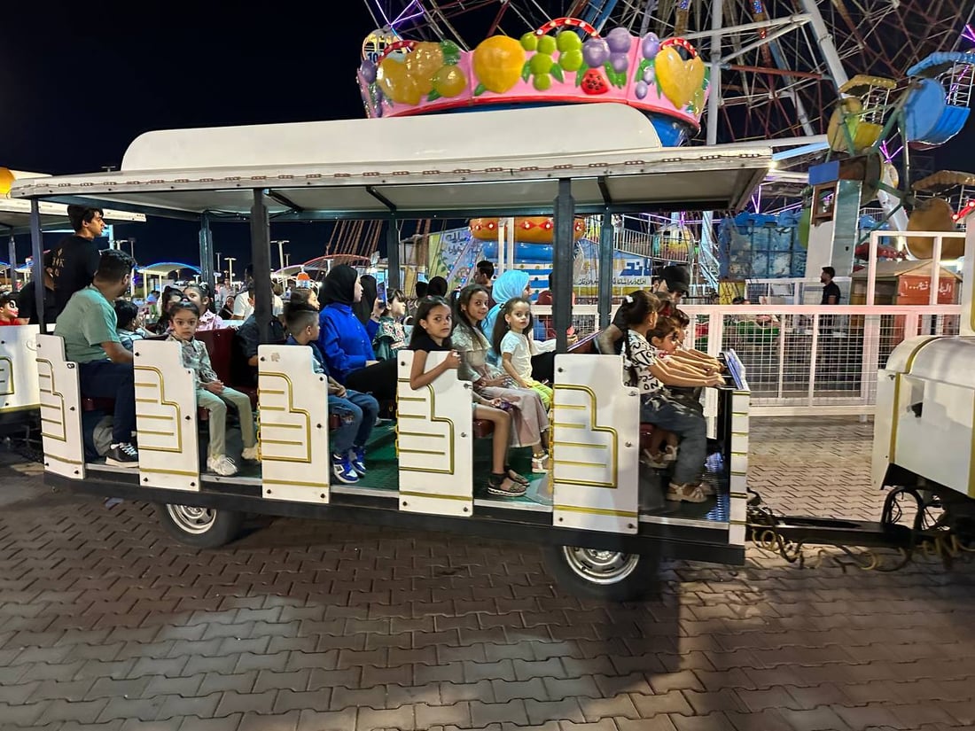 عيد البصرة.. عوائل كويتية تشارك العراقيين السمر حتى منتصف الليل في “هابي لاند” (صور)