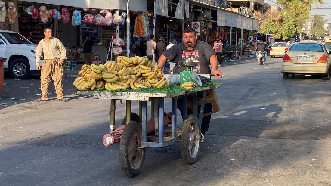 Erbil banana seller keeps 30-year family trade alive, hopes sons will follow