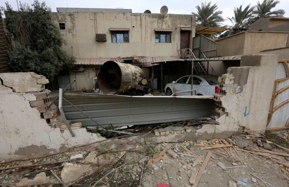 Debris are scattered across the ground, the morning after a reported gas tanker explosion in the Iraqi capital Baghdad, that killed at least nine people and injured around 13 others, on October 30, 2022. - The explosion, heard across much of Iraq's capital, was in a car park near a football field in a residential area of eastern Baghdad. (Photo by Sabah ARAR / AFP) (Photo by SABAH ARAR/AFP via Getty Images)
