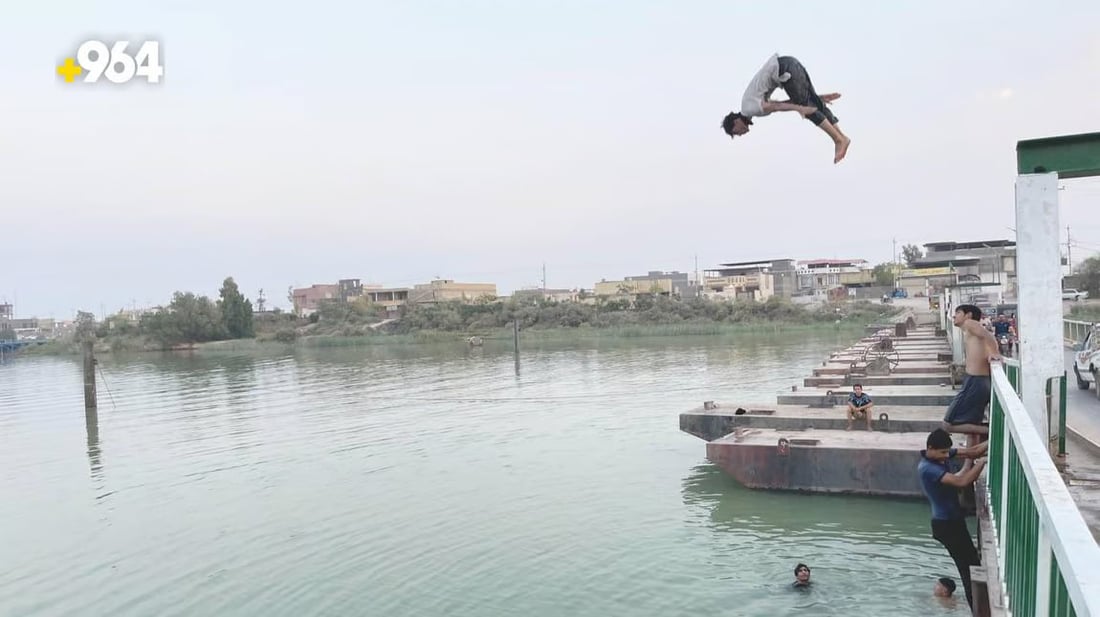 Basra residents cool off in area rivers amid staggering heatwave