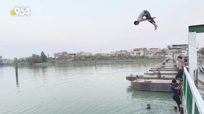 Basra residents cool off in area rivers amid staggering heatwave
