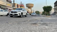 Residents urge Al-Mansour Municipality to repave Baghdad's Tanki Street