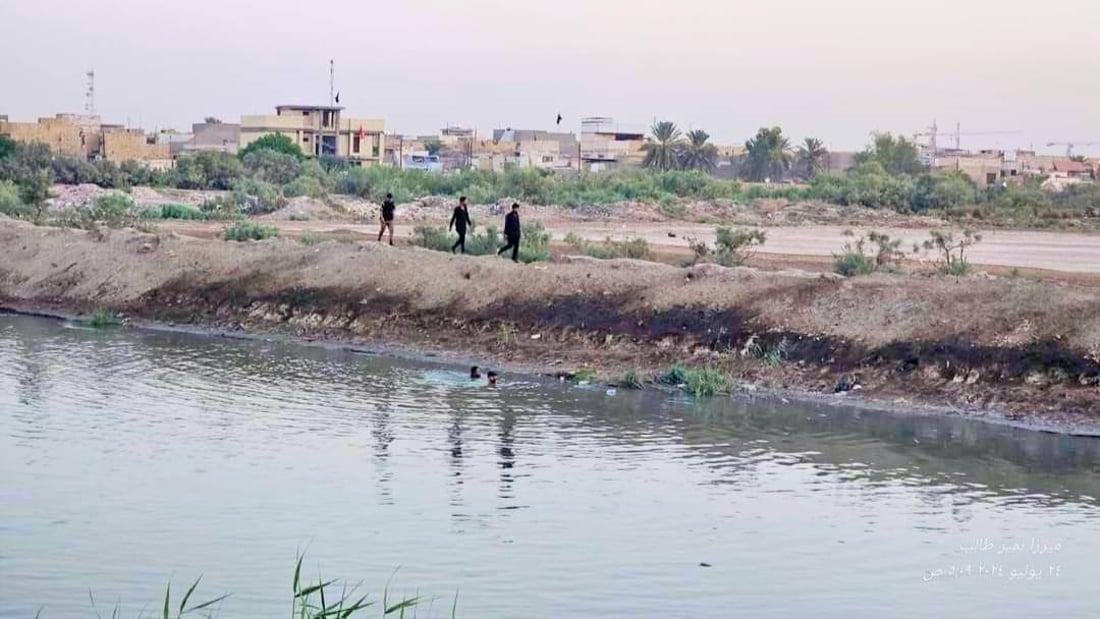 صور: غواصو سرايا السلام ينتشلون جثة طفل من نهر الديوانية