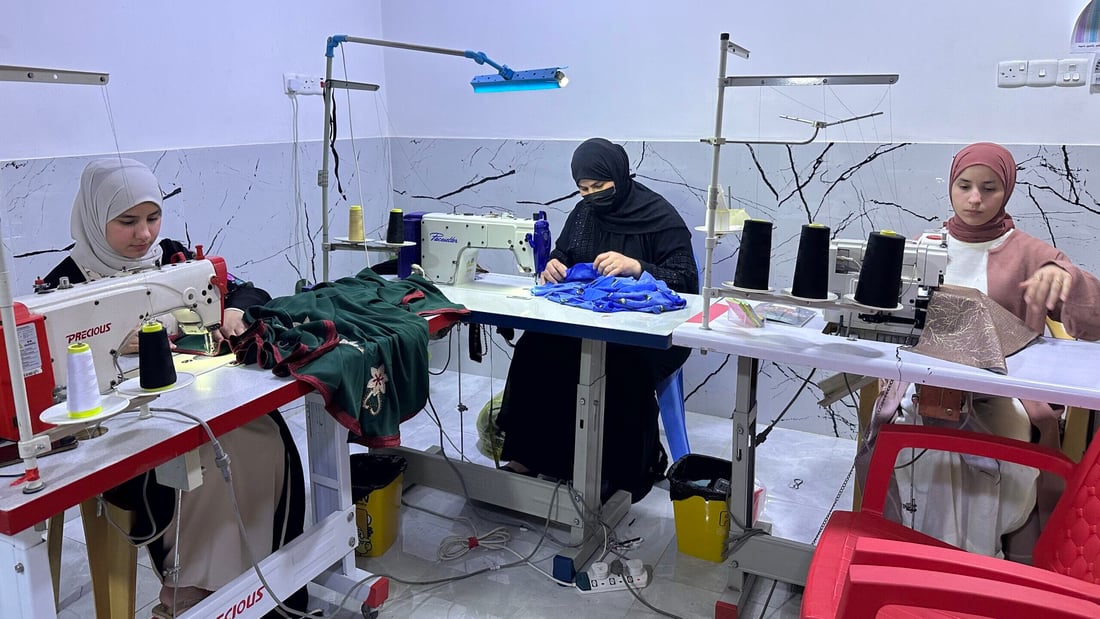 Displaced by war, seamstress builds thriving tailoring business in Hit