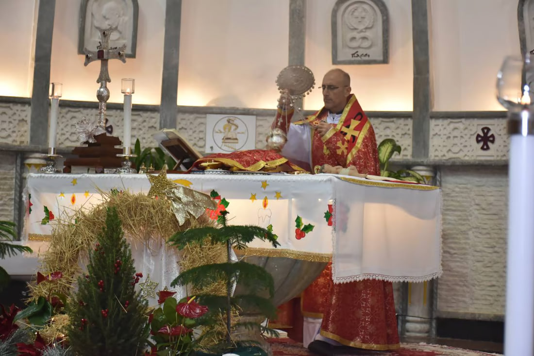 Photos: Somber Christmas Mass in Hamdaniya