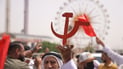 Under red banners, workers and activists rally in Basra for labor rights