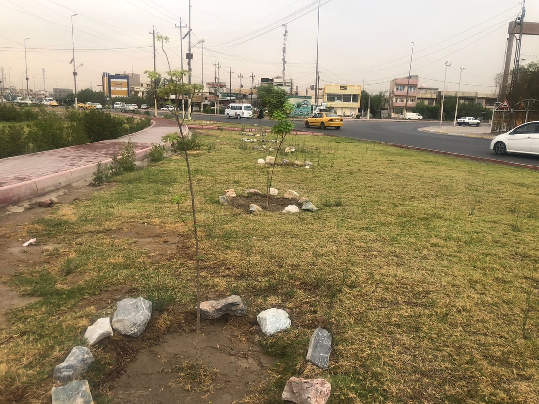 حديقة بدل القمامة عند مدخل حي الجهاد في بغداد.. أعمال التأهيل انتهت (صور)