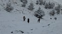 Snow drapes mountaintops around Sulaymaniyah as residents head outdoors
