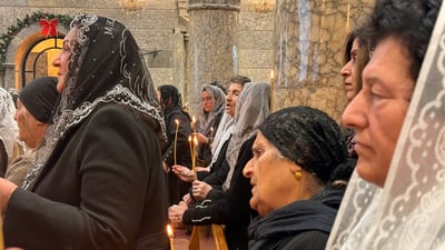 صور: سريان برطلة الأرثوذكس يحيون القداس الإلهي.. شموع وأمنيات للعراق