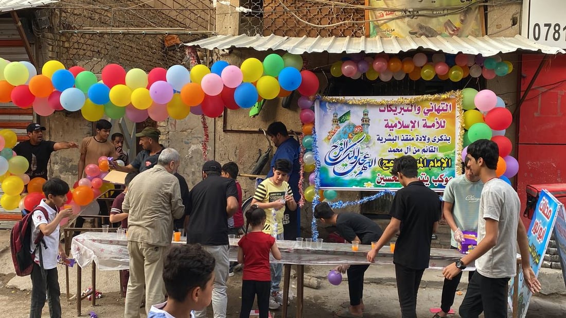 صور: حلوى وعصائر وأناشيد.. الاحتفال بمولد الإمام المهدي متواصل في الناصرية