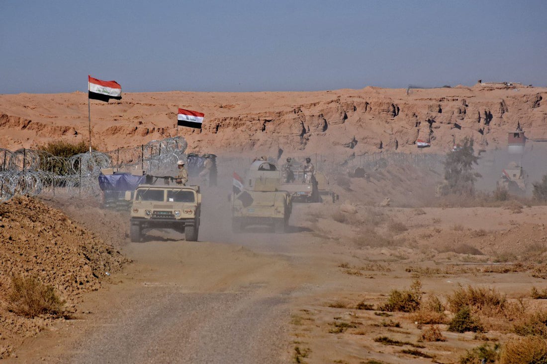 Iraq fortifies Syria border as Islamist opposition forces enter Aleppo