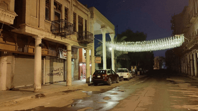 Al-Rashid Street: once a bustling hub, now dark and deserted.