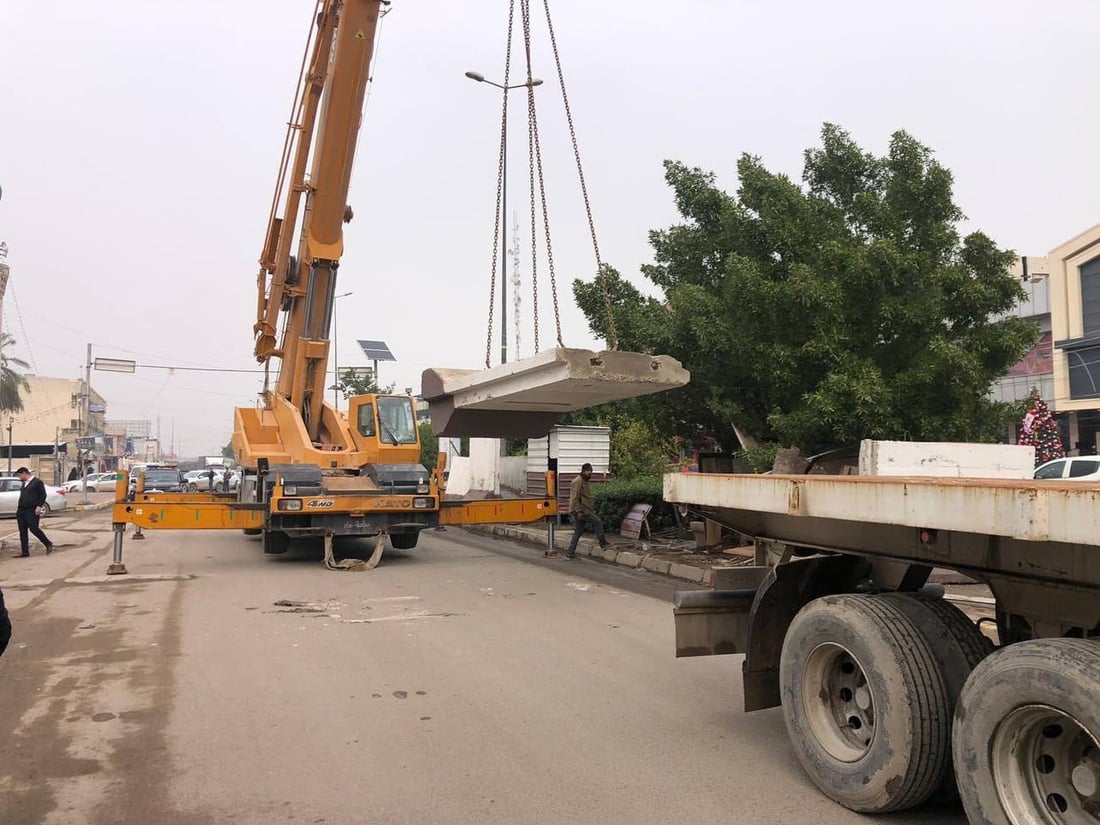 صور: رفع الصبات الكونكريتية من سيطرتي اللقاء والجامعة في بغداد