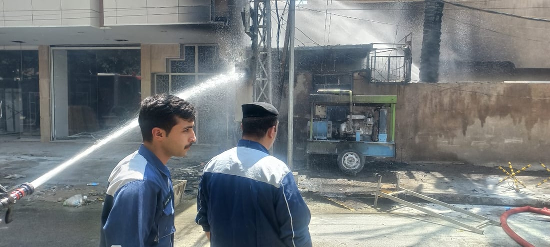 صور وفيديو: الدخان يغطي سماء الكرادة لكن تمت السيطرة على النيران