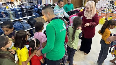 Volunteers in Mosul provide orphaned children with uniforms and school supplies