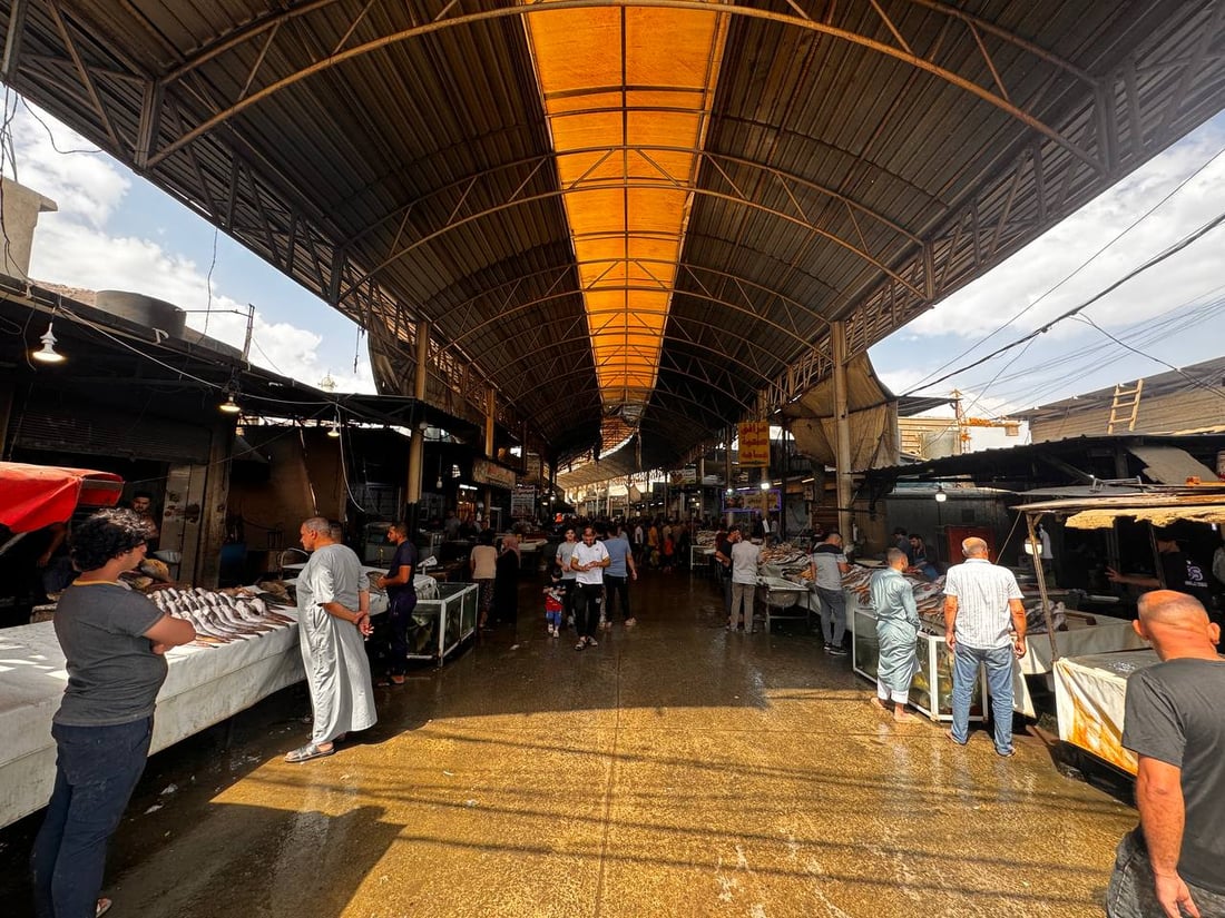 سوق السمك في الموصل ينتعش.. زوار أجانب يتوافدون يومياً (صور)