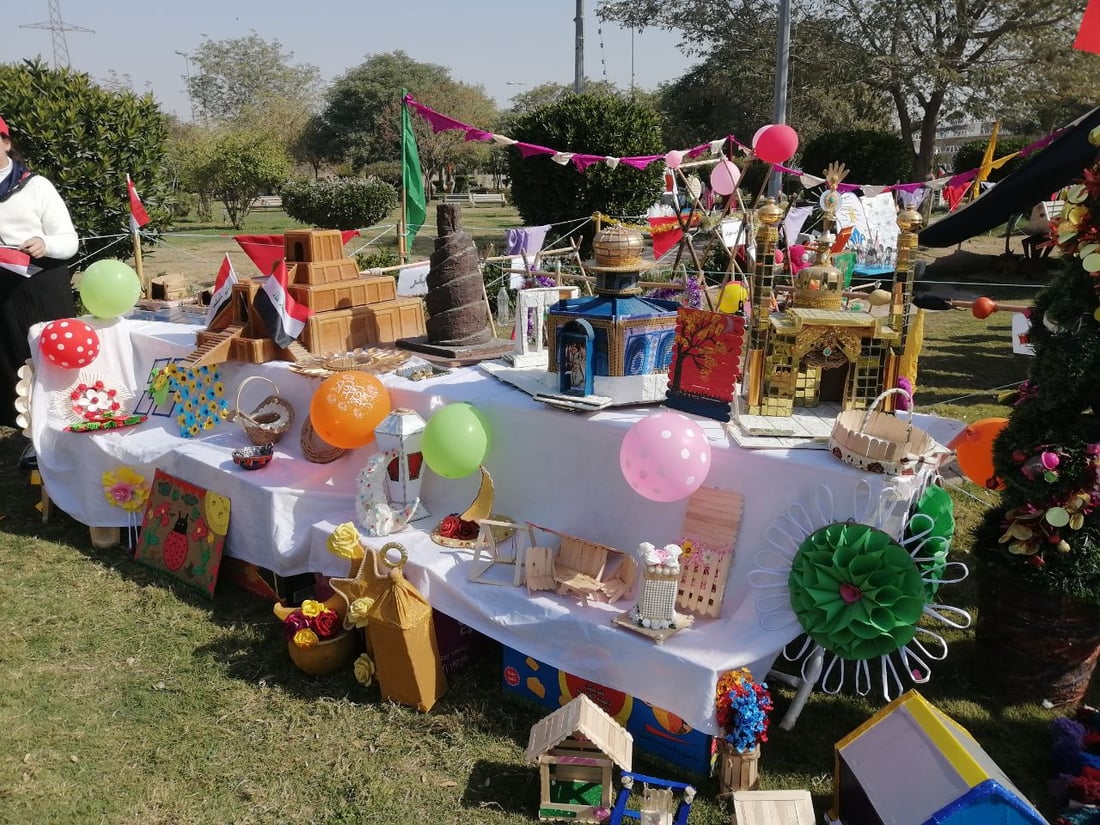 صور: صغيرات بابل يحتفلن تحت شمس الجنائن مع اللوحات والموسيقى