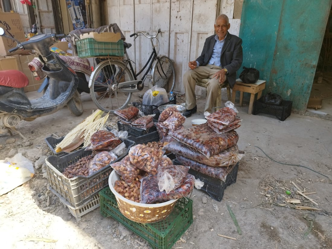 صور: رمضان في الحلة… دهن حر بـ30 ألفاً لمعالجة التمور وطبخ العنبر