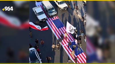 Four Baghdad police officers removed after US flag trampled at parade