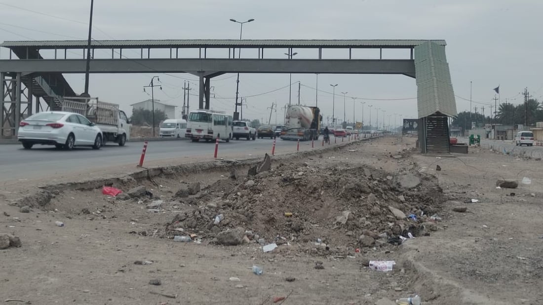 العمل متوقف بتأهيل مدخل بغداد الجنوبي منذ 11 شهراً.. تعليق من الأمانة (صور)