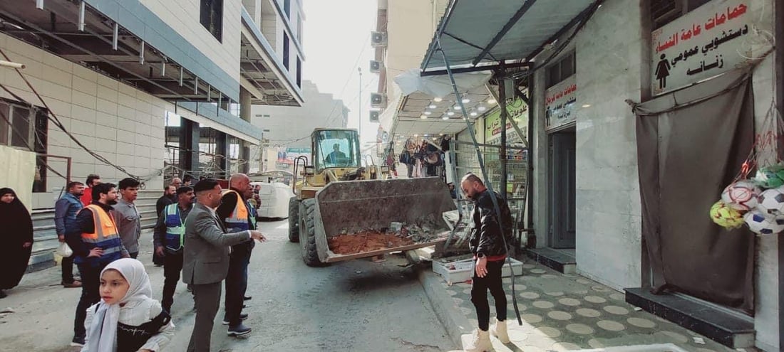 صور من النجف: الشفل الأصفر يقتلع البسطيات في شوارع الرسول والقديمة ومحيط الإمام
