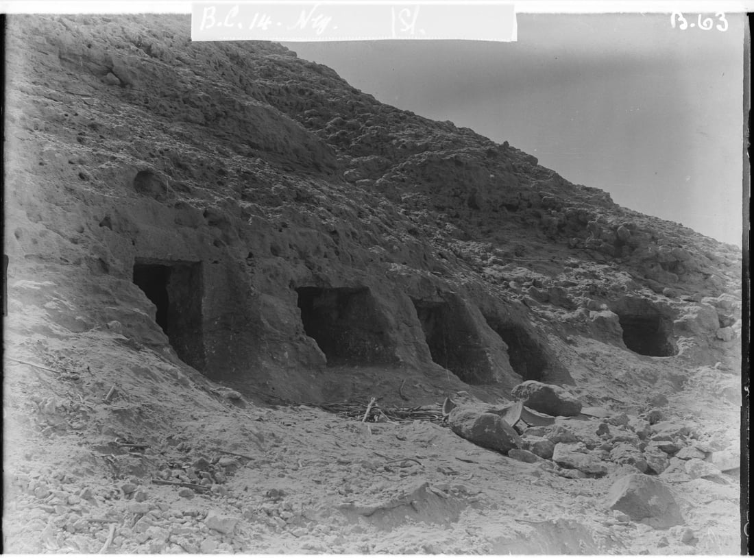 This photo provided by researchers shows rock-cut tombs in Nuwayrat, Egypt where a pottery vessel in which the remains of a man, radiocarbon dated to around 2855–2570 cal BCE, was discovered. (John Garstang, Mahmoud Abd El Gelel/Garstang Museum of Archaeology/University of Liverpool via AP)