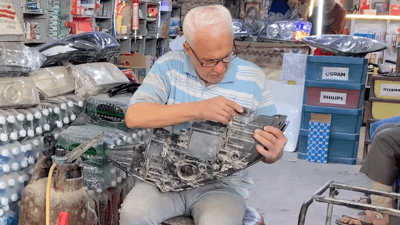 Hajji Jalil Al-Ramahi’s journey fixing headlights in Najaf’s industrial district