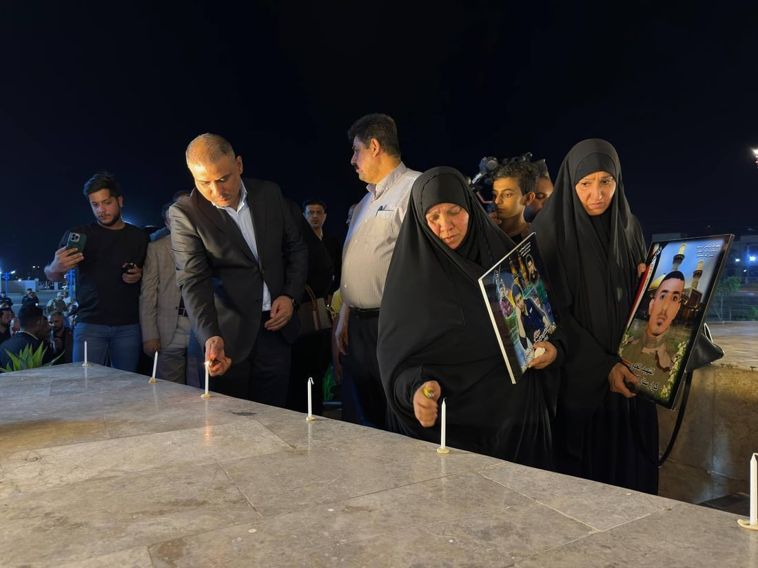 صور من الكوت: شموع وحزن حول نصب سبايكر في ذكرى المجزرة الأليمة