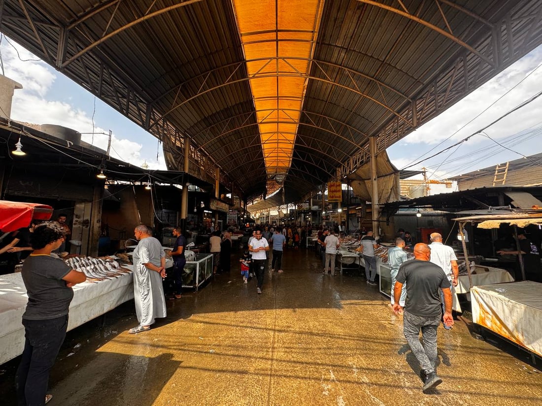 سوق السمك في الموصل ينتعش.. زوار أجانب يتوافدون يومياً (صور)