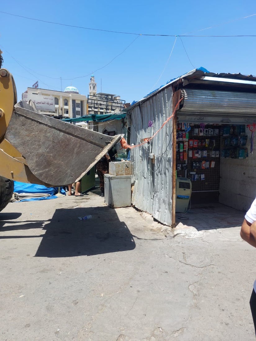 صور من حملة شرطة الرصافة لإزالة التجاوزات في بغداد الجديدة