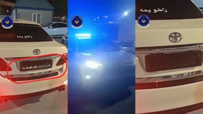 تاکسییەک رەقەمەکەی بەشێوەی دەڕاب داناوە و لەبەردەم کامێراکان شاردویەتییەوە