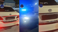 تاکسییەک رەقەمەکەی بەشێوەی دەڕاب داناوە و لەبەردەم کا�...