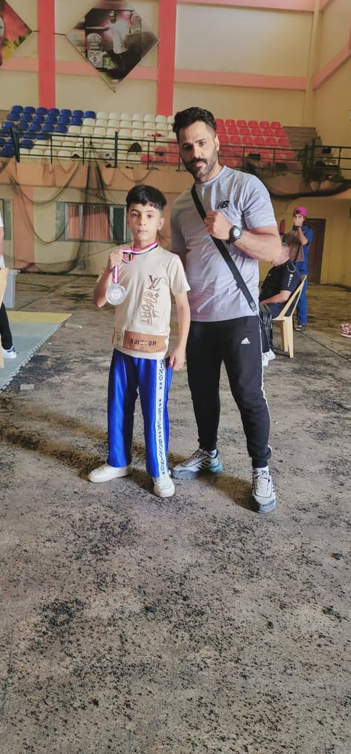 بعمر 11 عاماً.. فتى من الديوانية يحصد فضية “كيك بوكسينغ” العراق في النجف