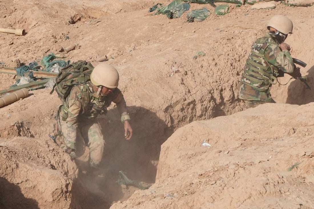 صور: قوات خاصة من الحشد الشعبي تجري تمريناً بالذخيرة الحية