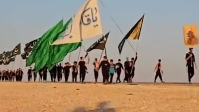 Pilgrims march through Al-Muthanna desert for Arbaeen