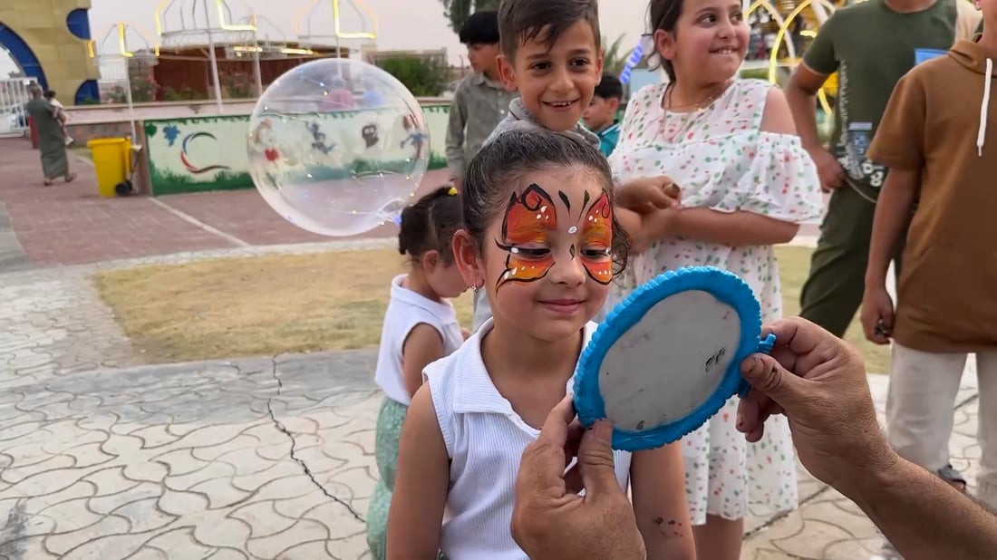 Baghdad artist brings face painting joy to children in Anbar’s city of Hit