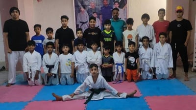 Young martial artists in Basra train in karate during summer break