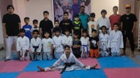 Young martial artists in Basra train in karate during summer break