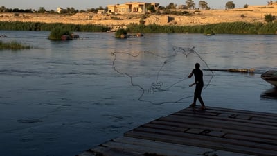 Opening of Haditha Dam gates draws crowds for fishing on the Euphrates