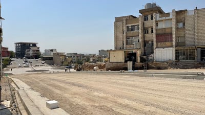 ژمارەیەک دوکان لە دووسایدکردنی شەقامێکی قەرەباڵغی سلێمانی رێگرن