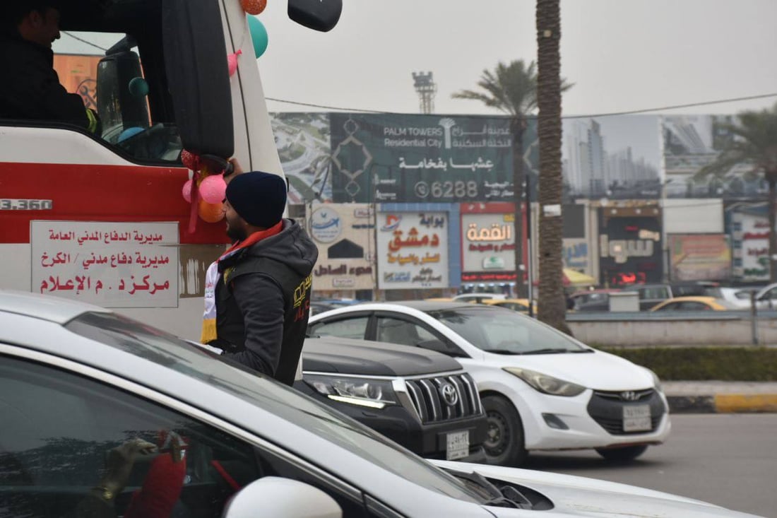 صور: بالأعلام والحلوى.. شباب أبو غريب يحتفلون بعيد الشرطة العراقية