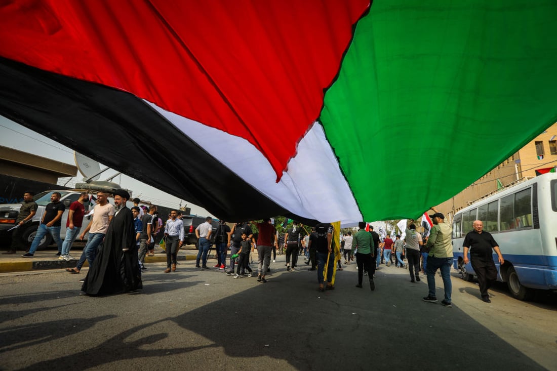 BAGHDAD, IRAQ - APRIL 29: People march towards the US Embassy in Baghdad to mark International Quds Day, an annual event to express solidarity with the people of Palestine, in the capital Baghdad, Iraq on April 29, 2022. (Photo by Murtadha Al-Sudani/Anadolu Agency via Getty Images)