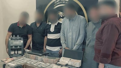 Intelligence agency in Baghdad arrests nine for illegal dollar trading and Mastercard smuggling