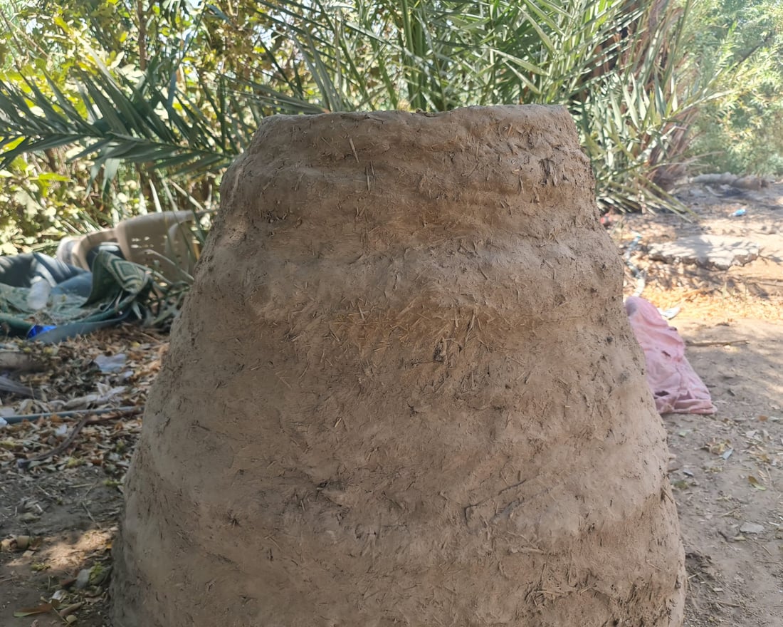 Diwaniyah women keep tradition alive with clay ovens for bread baking