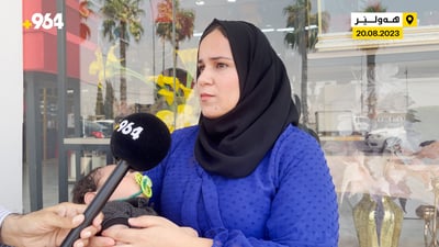 لە بەردەڕەشەوە بە منداڵێکی ساواوە هاتووەتە گردبوونەوەی مامۆستایانی وانەبێژ