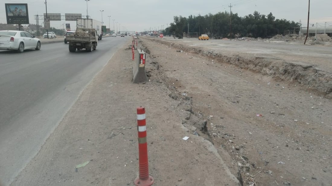 العمل متوقف بتأهيل مدخل بغداد الجنوبي منذ 11 شهراً.. تعليق من الأمانة (صور)