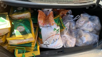 کارمەندانی هاتوچۆی دەربەندیخان هاوکاری 32 خێزانی کەمدەرامەت دەکەن