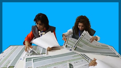 كارمه‌ندانى سه‌ر سندوقه‌كانى ده‌نگدان لە عێراق و هەرێمى كوردستان پاره‌ وه‌رده‌گرن