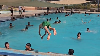 Decades-old Olympic pool in Dandan remains popular despite rise of indoor alternatives