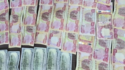 لە مارکێتێکدا دوو تۆمەتبار بە پارەى ساختەوە دەستگیرکران